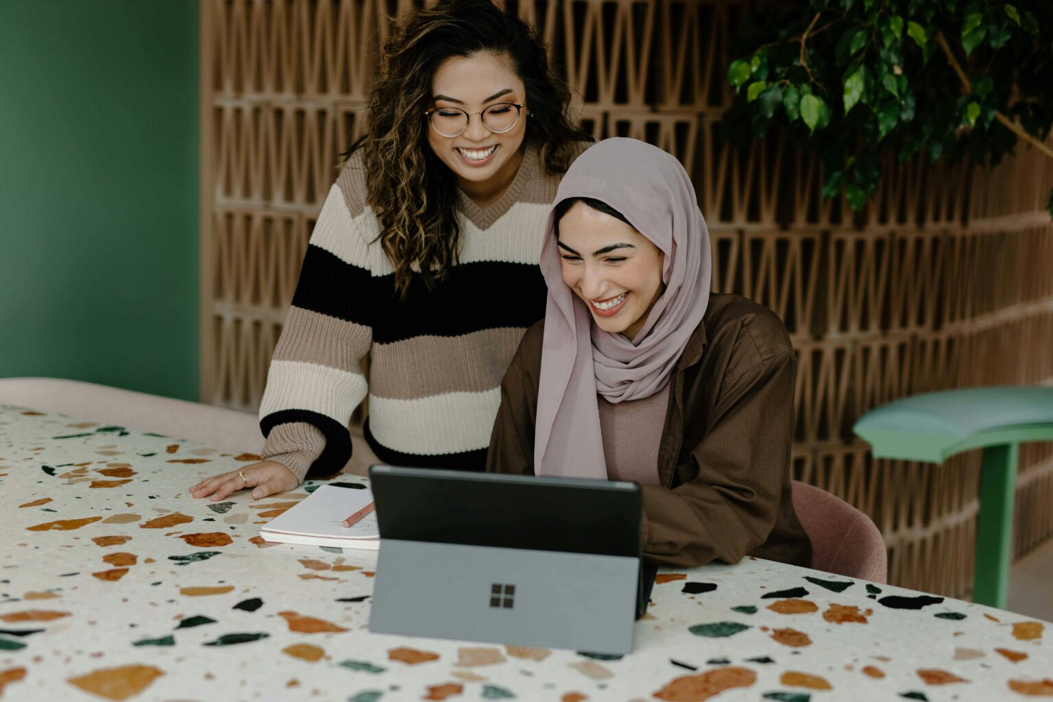 two ladies looking at computer